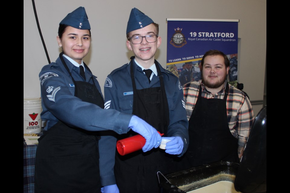 Kayla Smith, Connor Stephens and Hayden Fischer offer up some potato soup with leak oil on behalf of the Royal Canadian Air Cadet Squadron.