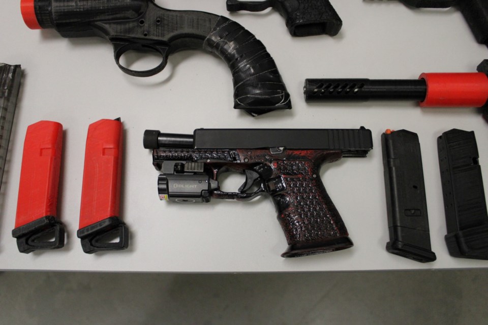 Handgun and ammo, plus plastic firearms and parts made with 3D printer, found in execution of search warrant in Stratford.
