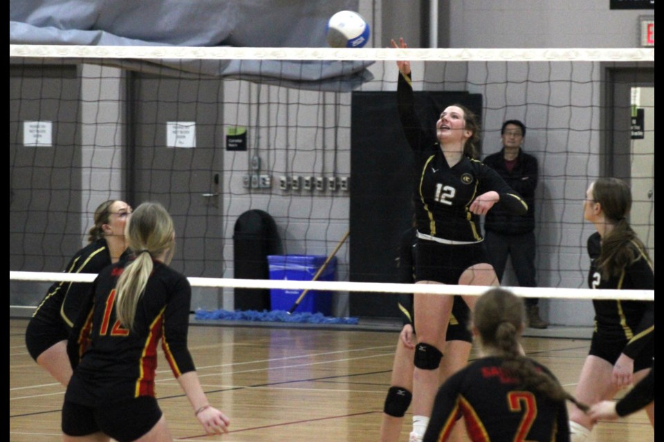 Summer Emms (12) of Stratford District Golden Bears guides the ball over the net against the Saunders Sabres during their WOSSAA 'AAA' bronze medal match on Thursday. 