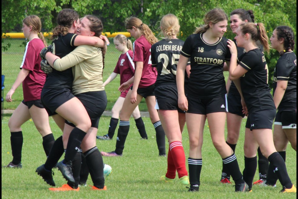 Alli Whittaker hugs Golden Bear teammate and goalie Ella Smith after the final whistle on Tuesday. 