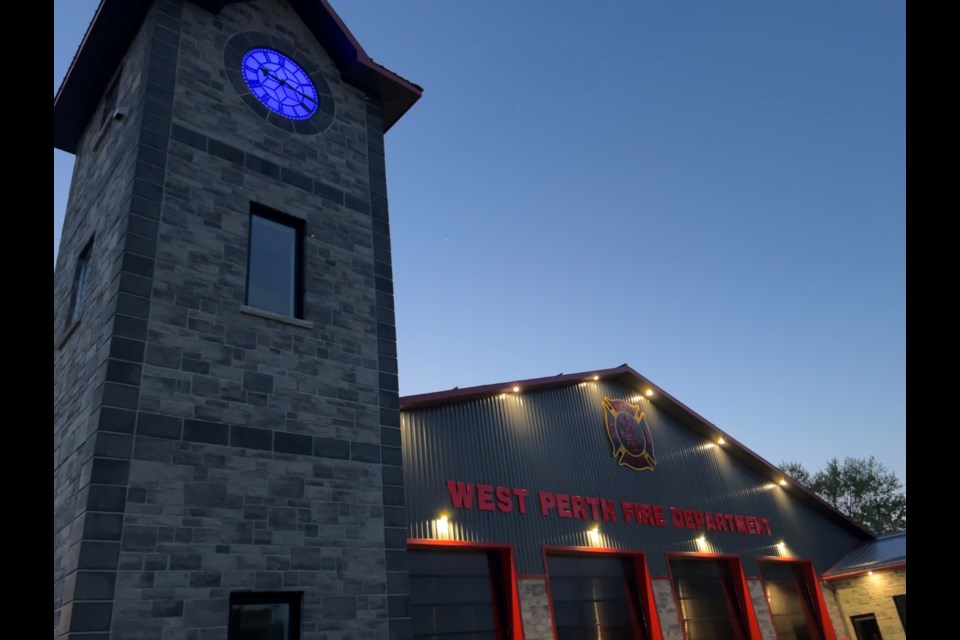 The clock tower face of the Mitchell Fire Station is lit blue in honour of Det. Const. Steven Tourangeau, who died in the line of duty. Courtesy of John Nater, M.P.