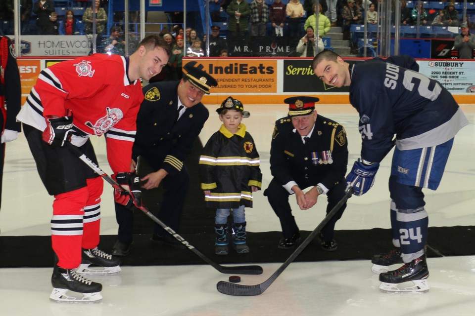 Sudbury Police and Firefighters took to the ice at the Sudbury Community Arena Thursday to play hockey and raise funds for the NEO Kids Foundation. (Len Gillis/Sudbury.com)