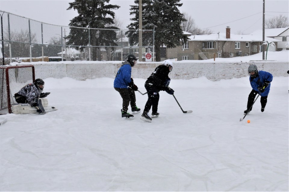 Players scrambling at the net in the annual Sudbury Pond Hockey on the Rock tournament. (Len Gillis/Sudbury.com)