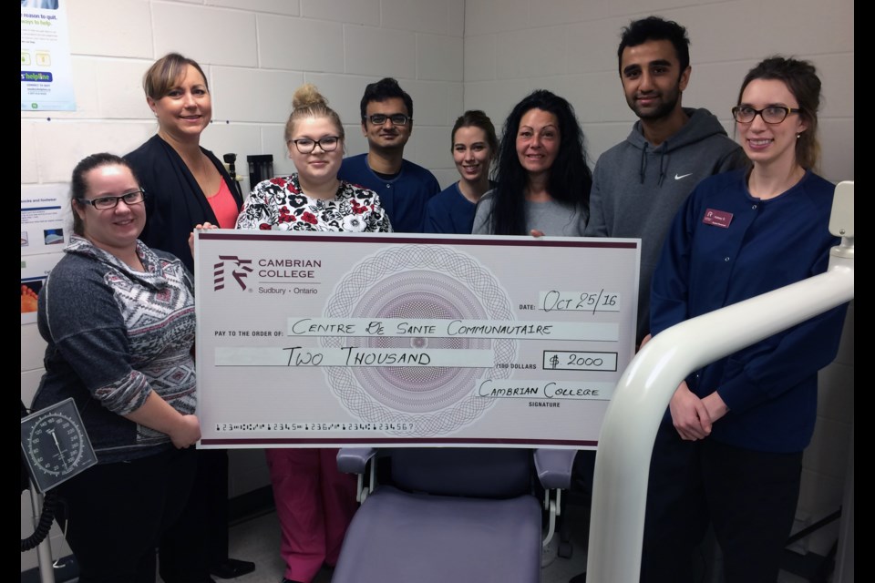 Dental students donated $2,083.51 to the Cambrian College Student Food Bank. (L-R) Kelsey St. Amour, Amelia Weekes-Thornhill, and SAC President Rhaili Champaigne.