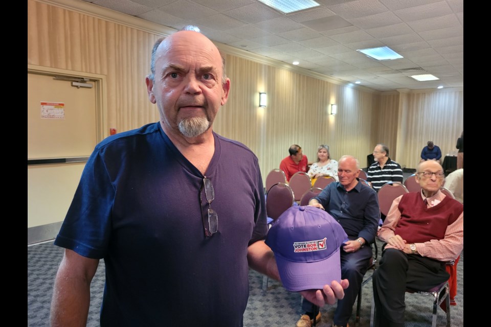 Greater Sudbury mayoral candidate Bob Johnston holds up a hat he had made for distribution at Friday’s campaign launch at the The Northbury Hotel and Conference Centre. 

Tyler Clarke / Sudbury.com

