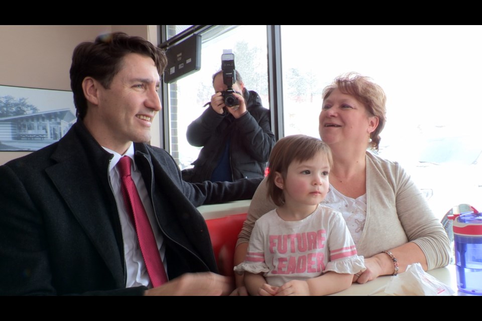 Prime Minister Justin Trudeau kissed babies, pressed the flesh and enjoyed a classic Deluxe chicken-on-a-bun meal with a side of poutine, during a whistlestop in Greater Sudbury on Feb. 13. Trudeau was in town to visit the site of the Maley Drive extension project. (Heather Green-Oliver / Sudbury.com)