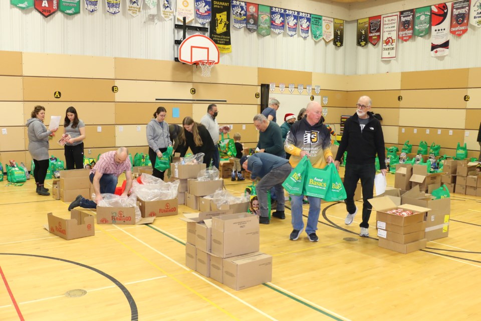 Scores of volunteers took part in creating and delivering Christmas food baskets in Sudbury on Saturday, (Len Gillis/Sudbury.com)