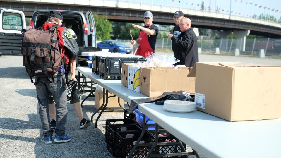 The Greater Sudbury Landlord Association (GSLA) and the Elgin Street Mission teamed up July 22 to deliver an outdoor barbeque for people in need of a meal, as well as provide a $500 donation to assist in the mission’s operations. (Eden Suh / Sudbury.com)
