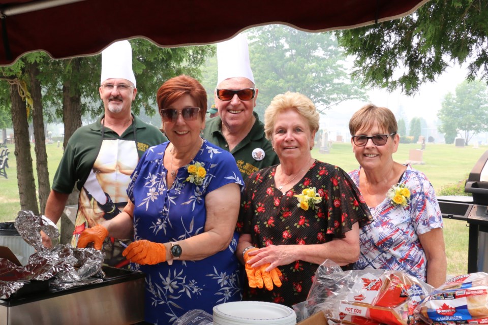 Community volunteers provided a barbecue at the Garson St. John's Cemetery on Sunday. They were, from left, Terry Laroque, Diane Brown, Gord Brown, Normima Monaghan and Deborah Jalbert.  (Len Gillis/Sudbury.com)
