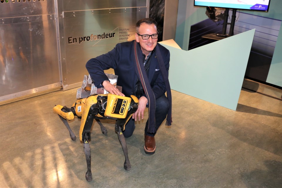 Northern Development minister Greg Rickford met "Spot" the robotic mining dog during a visit to Sudbury Friday where he announced a $1.5-million grant for Science North.  (Len Gillis / Sudbury.Com)