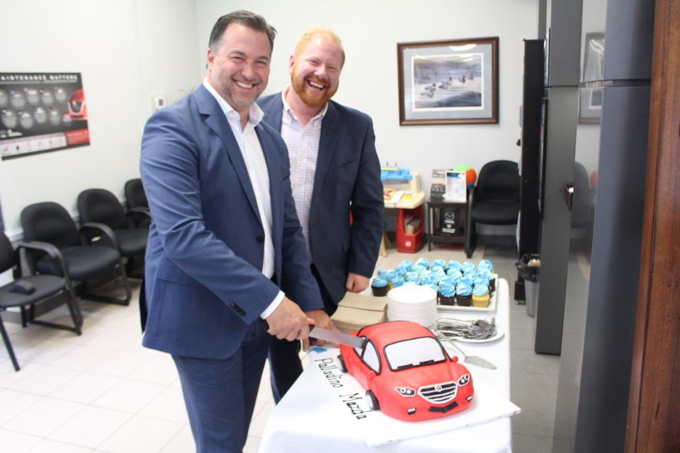 The Palladino Auto Group celebrated the grand opening of their Palladino Mazda dealership on the Kingsway on June 21. Owner Vince Palladino and general manager Jamie Digby cut the cake. (Photo: Matt Durnan)