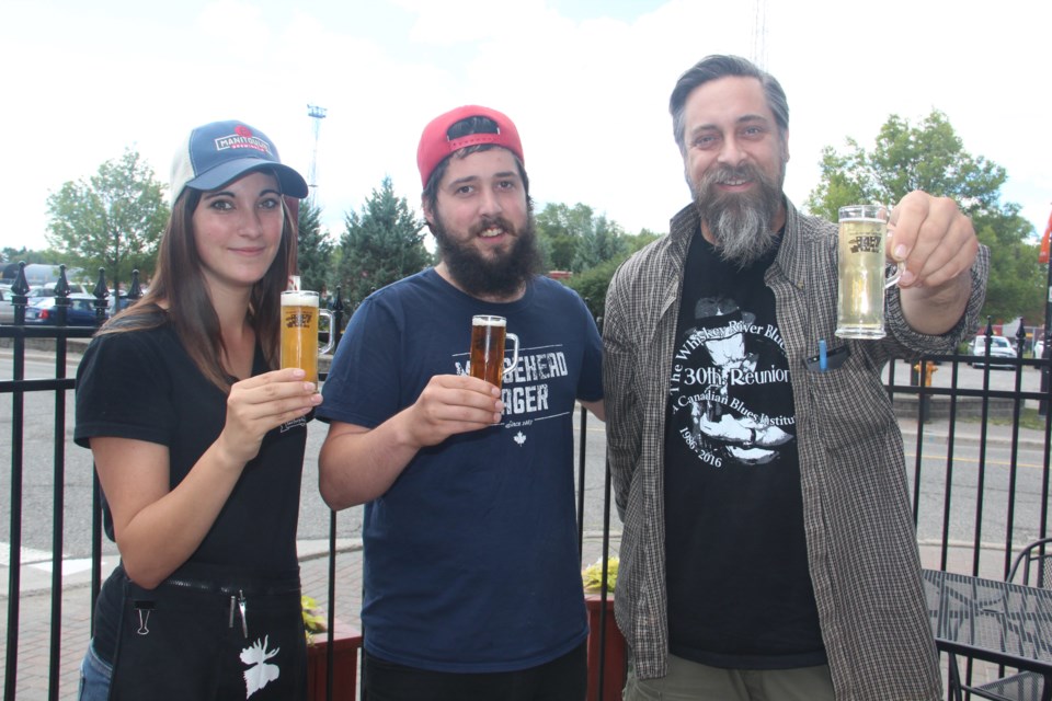 The Elgin Street Craft Beer Festival takes place this weekend, and Townehouse staffers (from left) Kallie Jack, Sam Cassio and Paul Loewenberg couldn't be more excited. Photo by Heidi Ulrichsen