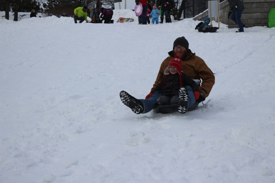 Sliding, skating and more kept families outside and occupied during Snow Day on Saturday. (Gia Patil)
