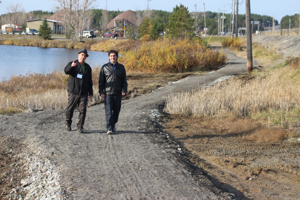 Long-time Wahnapitae resident, Daniel Venne (left) and Rainbow Routes Executive Director, Daniel Barrette, take a stroll down the new trail. Photo by Heather Green-Oliver