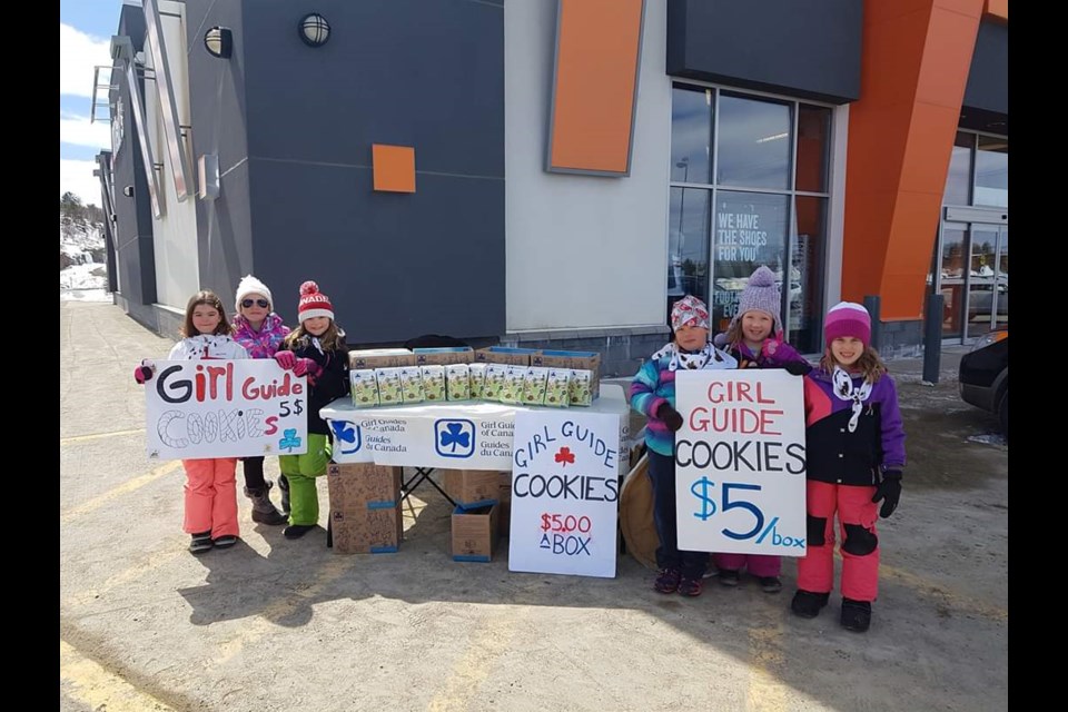 The 1st Hazelmere Brownies are seen here selling cookies in 2019. (Supplied)
