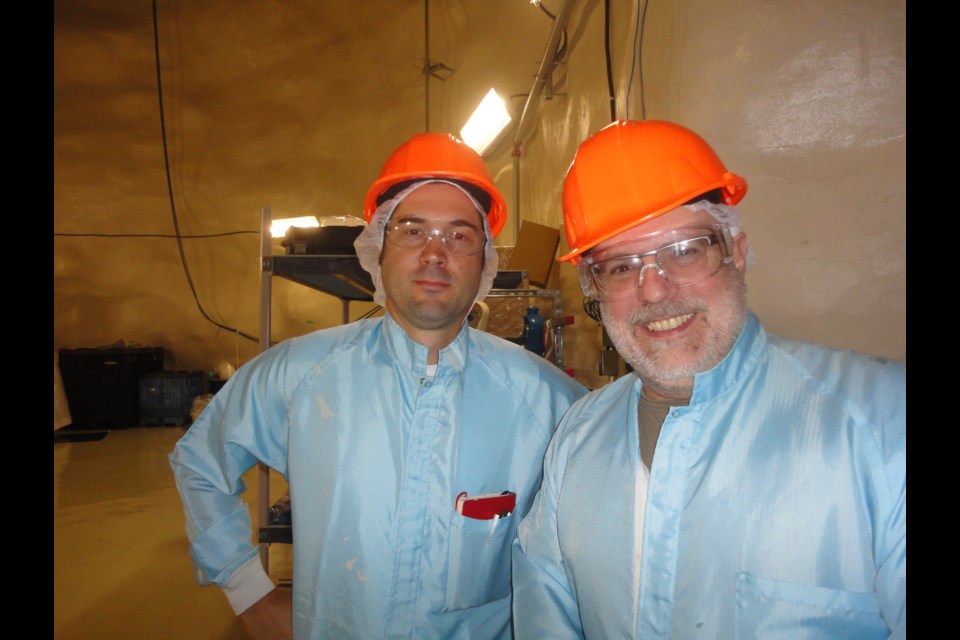 Poet Thierry Dimanche and composer Robert Lemay suited up for art, while producing “2000 meters underground,” a composition of music and poetry recorded two kilometres below ground in the SNOLAB research facility. (Supplied)