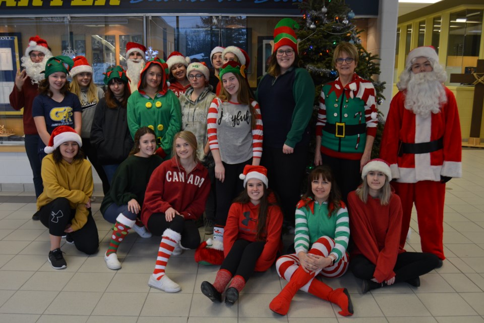 Students and staff at Bishop Alexander Carter Catholic Secondary School got in the Christmas spirit today, with many dressing up as elves or the chief elf himself, Santa Claus. (Supplied)