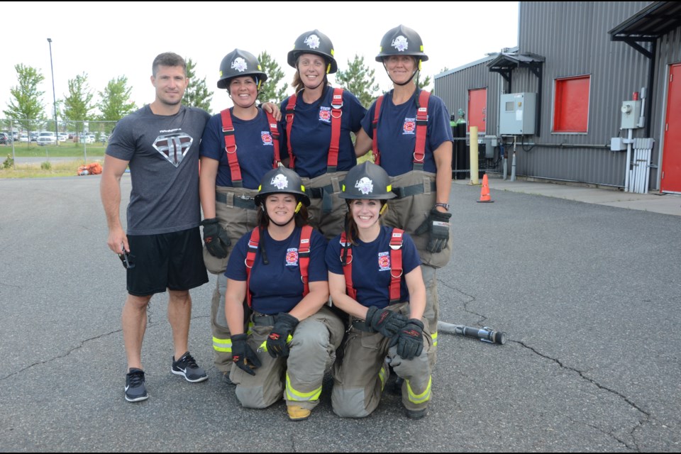 Sarah Brosha, Tammy Joyce, Laura Amyot, Nicole Brabant and Kerry McCallum will travel to Wasage Beach this weekend for the Northern Ontario Regionals of the Canadian FireFit Championships. They are seen with their coach, Trevor Fera. Photo by Arron Pickard