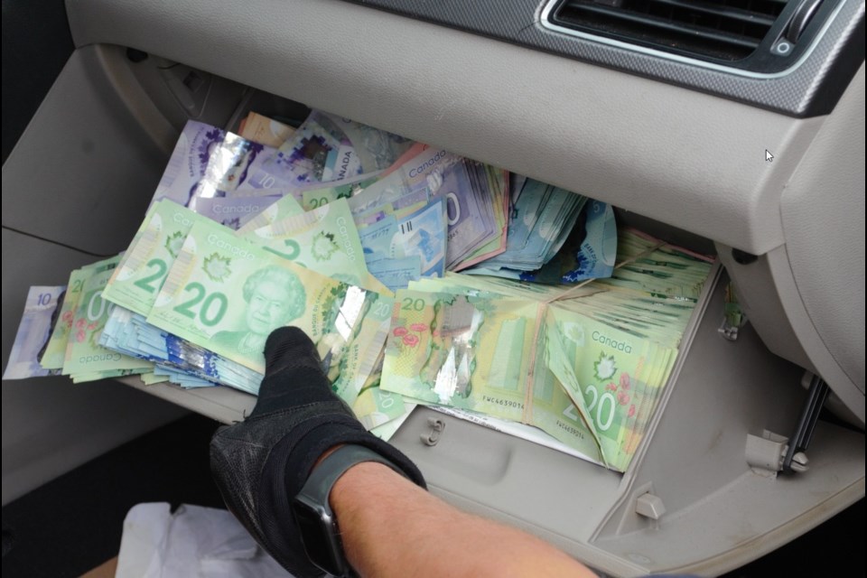 The Ontario Provincial Police seized more than $45,000 in suspected drug money after they pulled over a speeding vehicle on Highway 69 on Aug. 30. (Supplied)