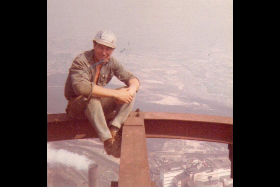 Aarne Kovala is seen here sitting on the top of the Superstack, which he helped to build in the 1970s. (Supplied)