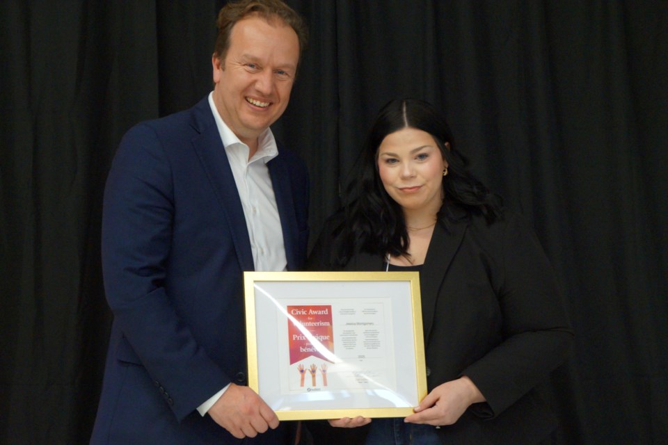 Seen here with Mayor Paul Lefebvre is Jessica Montgomery, who logged more than 400 volunteer hours per year (for the last nine years) at charities and organizations across the Nickel City. 