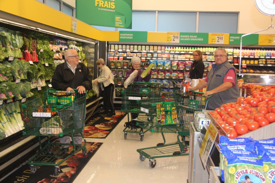 Shoppers check out the new Chelmsford Food Basics Thursday morning. (Heidi Ulrichsen/Sudbury.com)