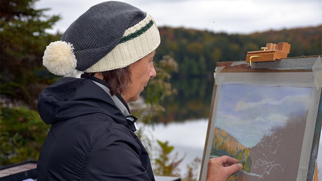 Plein air artist Christy Smith, seen here in 2015, plans to spend December 2018 and January 2019 painting in the great outdoors, knocking off two more months in her 12-year quest to paint the outdoors every month of the year. (Supplied)