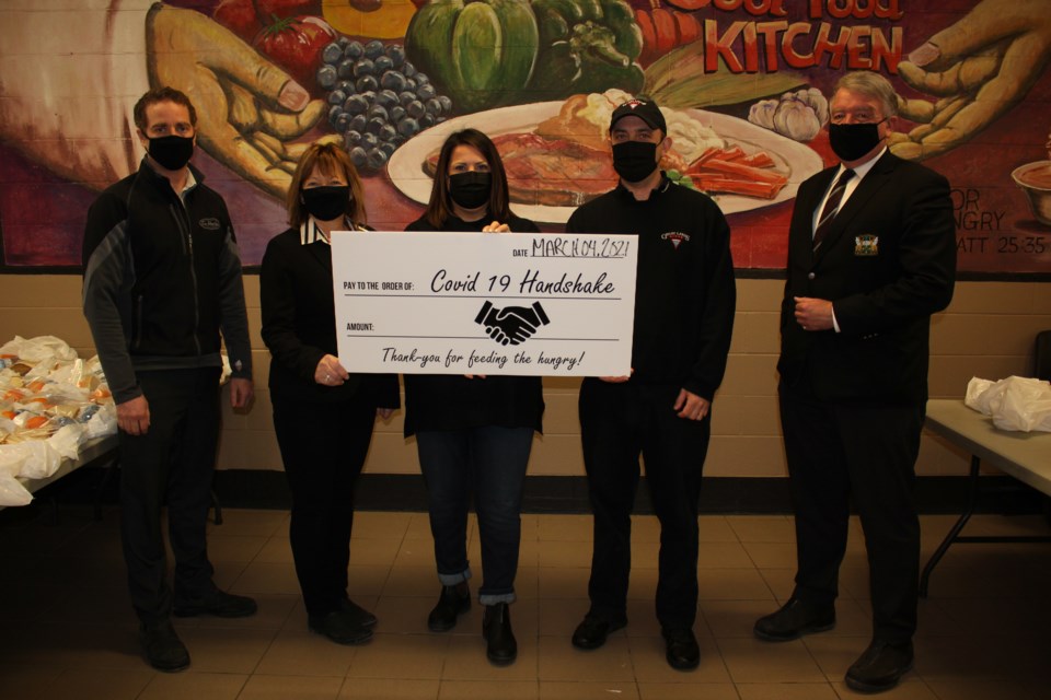 From left are Troy MacKenzie, Tim Hortons Lasalle Boulevard, Marian MacKenzie, Tim Hortons Lasalle Boulevard, Amanda Robichaud, director/chaplain of the Elgin Street Mission, Kevin Thomas, Great Lakes Pizza, and Gerry Lougheed, chair of the Community Care Team.