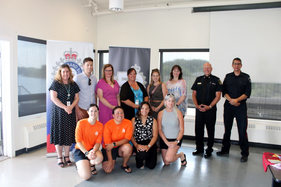 Representatives from some of the 16 service organizations joining Greater Sudbury police for this year’s Truth and Reconciliation Relay gather for a photo with police at the Northern Water Sports Centre on Tuesday.