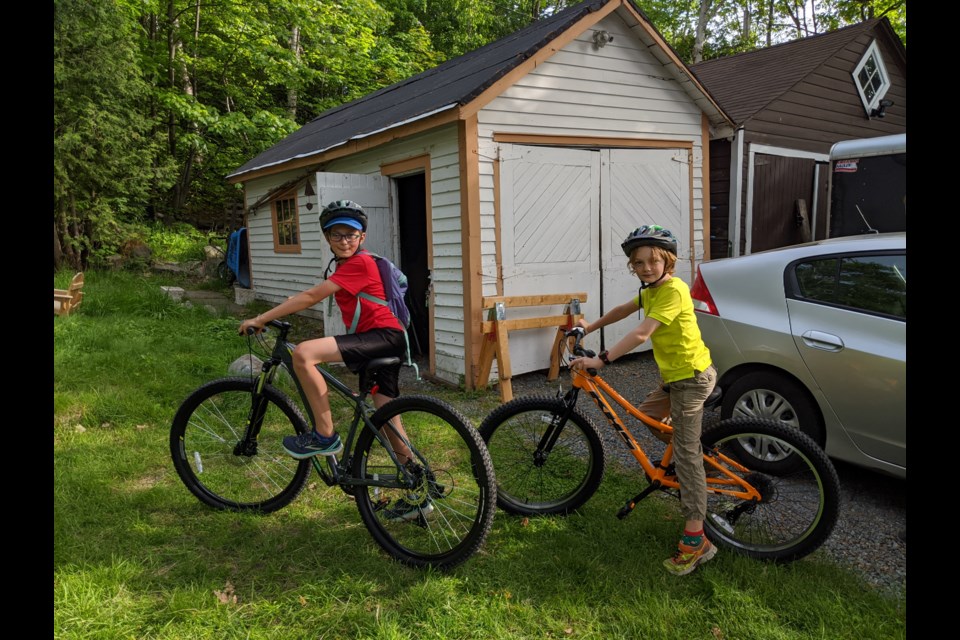  Clark and Emmerich MacIntyre, aged 9 and 12, with the new bikes they helped buy with their allowance money.  They really enjoy riding their bikes to go to the park, take family bike trips, or even zipping downtown for an orthodontics appointment. (Supplied)