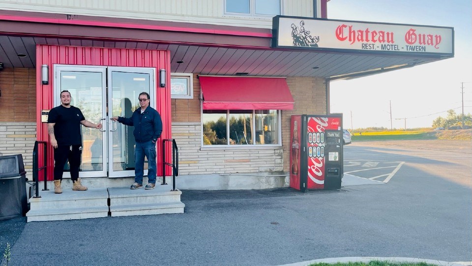 Mike Saucier and his son Dylan in front of the Chateau Guay doors.  Dylan is managing the restaurant and motel with his family.