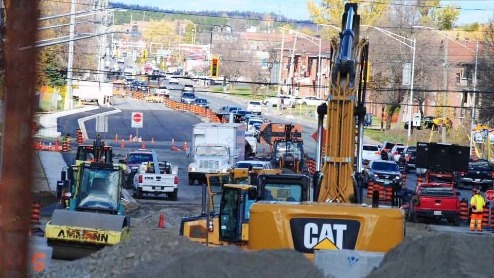 Contractors are seen working on Barrydowne Road earlier this week as part of a $6-million municipal project to upgrade both the arterial road’s underground infrastructure and its surface.