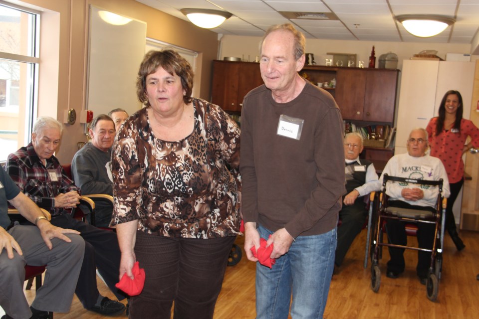 Debbie and Dennis Serafini are seen here playing bean bag toss at the Alzheimer Society adult day program in this Sudbury.com file photo from January 2013. Dennis passed away three years ago at age 60 after living for years with Alzheimer Disease. Debbie is still helping to raise awareness of the disease. File photo.