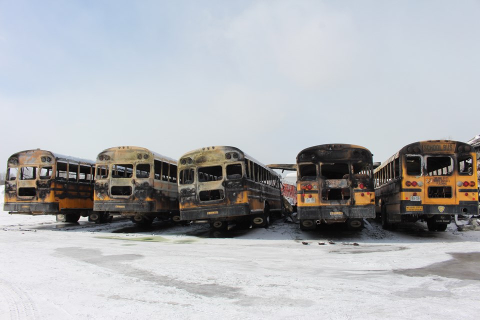 This was the scene at the C&D Bus Lines bus yard in Chelmsford this morning after last night's fire that destroyed five school buses and a bus shelter. (Matt Durnan/Sudbury.com)
