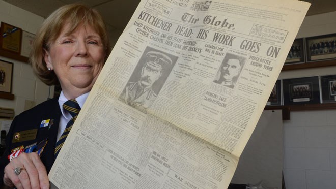 Gisele Pharand, public relations, Royal Canadian Legion Br. 76, shows off a newspaper published during the First World War. It's one of many items the Legion has on display from both world wars. (Arron Pickard/Sudbury.com) 