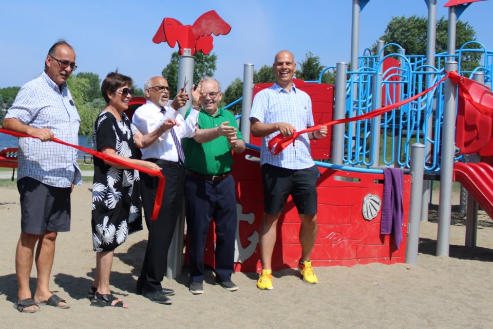 Political dignitaries joined United Way Centraide North East Ontario board members in cutting the ribbon to the new playground structure at Moonlight Beach Park in Sudbury on Wednesday. From left is Ward 11 Coun. Bill Leduc, board member Mila Wong, chair Hanumantha Rayudu Koka, Ward 8 Coun. Al Sizer and Sudbury NDP MPP Jamie West.