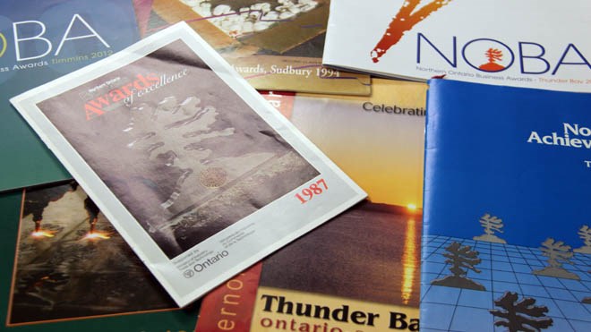 Just some of the many commemorative magazines published for the Northern Ontario Business Awards over the past 30 years. The awards program celebrates three decades tonight (Oct. 6). Photo by Heidi Ulrichsen