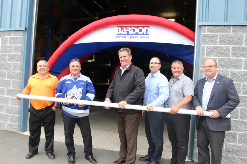 Flocor welcomed southern HVAC and plumbing supplier Bardon Supplies to Sudbury with a non-traditional ribbon cutting on Oct. 5. From left are: Bardon/Flocor branch manager Craig Wafer, Deschênes Group vice-president of operations Joe Senese, vice-president/general manager of Bardon Supplies Bob Pryor, Eastern manager of Bardon Supplies Shawn Taylor, regional manager of Bardon Supplies North Steve Board, vice-president/general manager of Flocor Tom Murrary. (Heather Green-Oliver/Sudbury.com)
