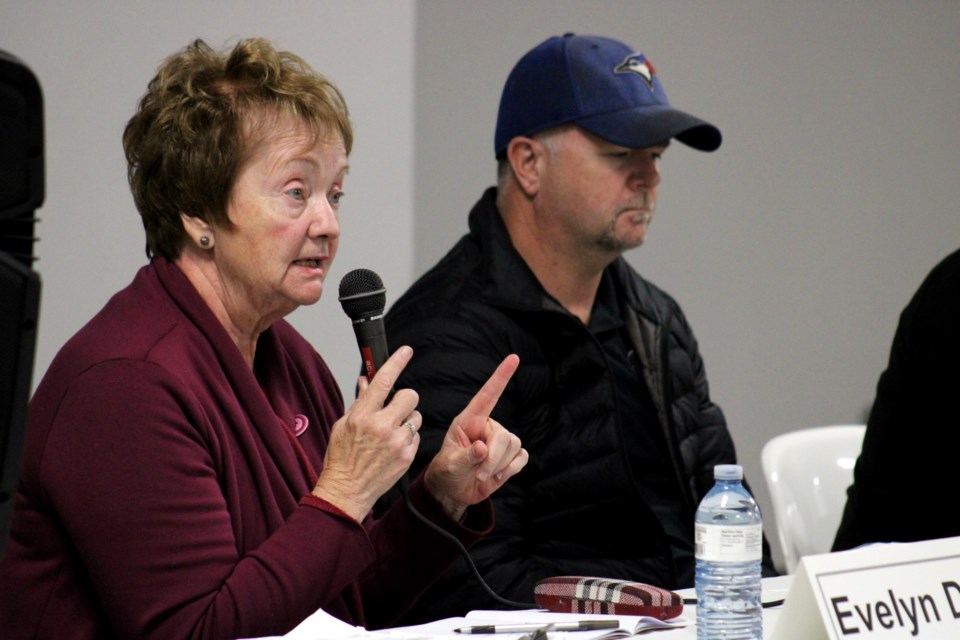 Mayoral candidate Evelyn Dutrisac answers a question from the audience during Wednesday’s mayoral debate in Capreol as fellow candidate Don Gravelle looks on.