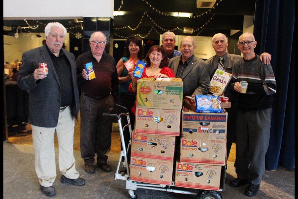 Members of Unifor Local 598 continued more than 20 years of giving with a donation valued at $1400 for Sudbury Food Bank on December 5, 2018. From left to right: Christina Beaudry and Gil Beaudry (back row); Mel Papke, Ben Robinson, Cathy Mikkelsen, former Sudbury Food Bank chair Joe Drago, Tom Ranelli, and Emile Prudhomme, former president, Unifor Local 598. (Allana McDougall/Sudbury.com)
