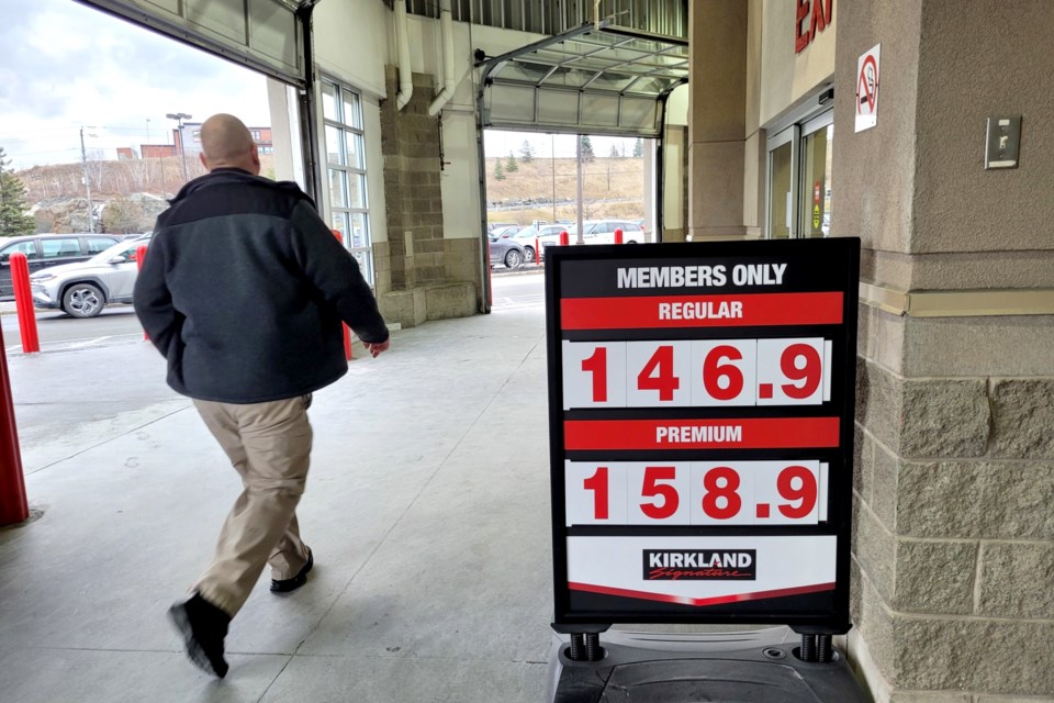 A sign at the main entrance to Costco advertises gas prices as 146.9 for regular and 158.9 for premium for Monday, Dec. 5, 2022.