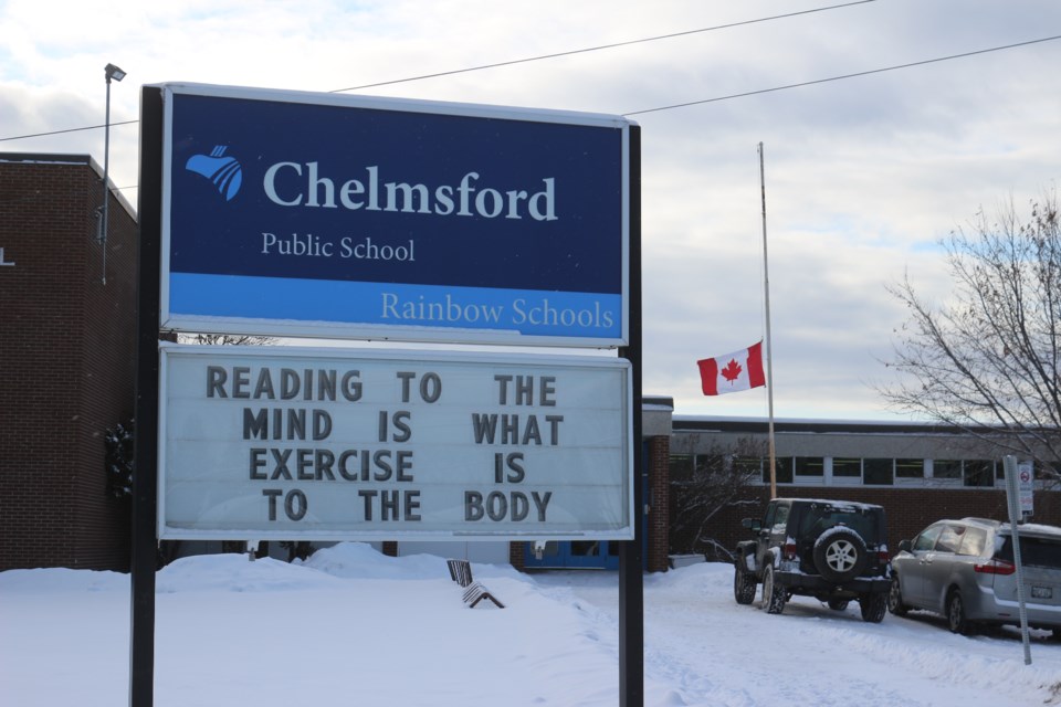 The flag flies at half-mast at Chelmsford Public School Jan. 6 as the school mourns the deaths of three of its students in a Jan. 1 collision. (Heather Green-Oliver/Sudbury.com)
