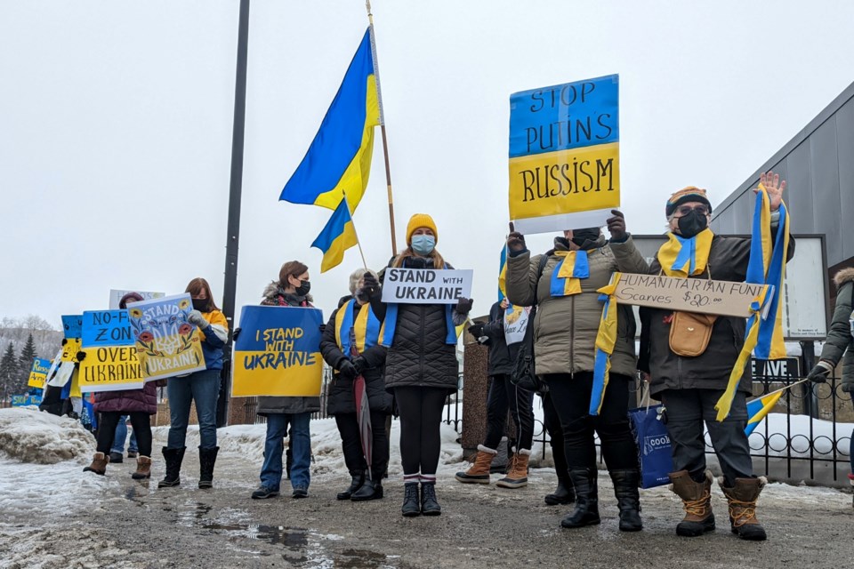 Notre Dame Avenue near the Ukrainian Seniors Centre was awash in yellow and blue Sunday morning as more than 100 people rallied in solidarity with Ukraine, which is being invaded by Russia.