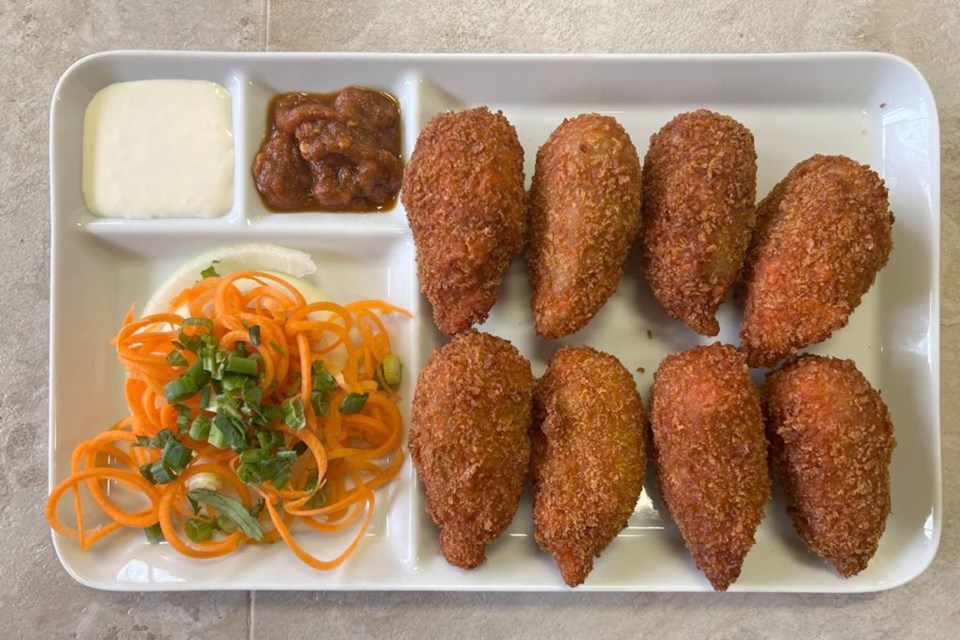 Kurkure Momos, an appetizer on the J & M menu offers customers a crunchy and juicy dumpling that is seasoned, coated and breaded with deep-fried cornflakes.  This dish is native to Tibet and Nepal.