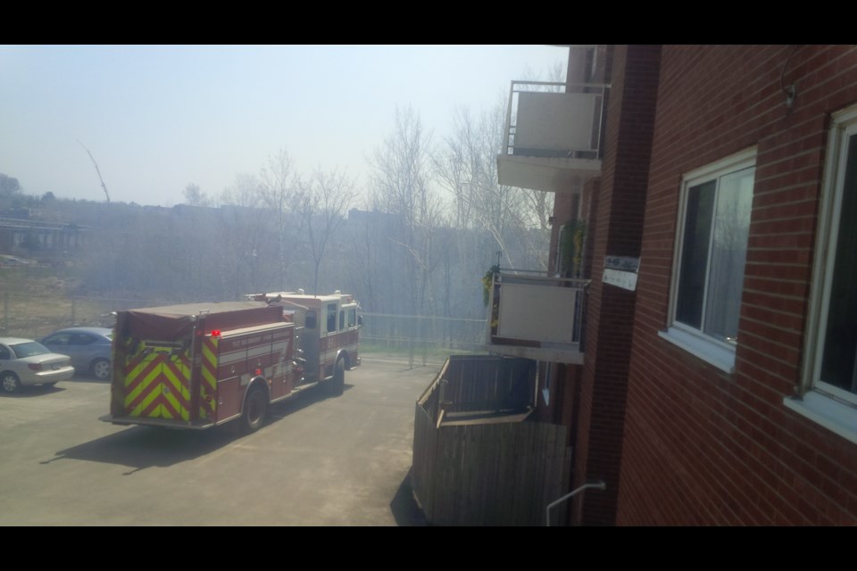 Sudbury.com reader Tammy Tremblay managed to snap this image of the fire behind Lockerby Composite before firefighters arrived. She said the fire was small, but produced a lot of smoke.
