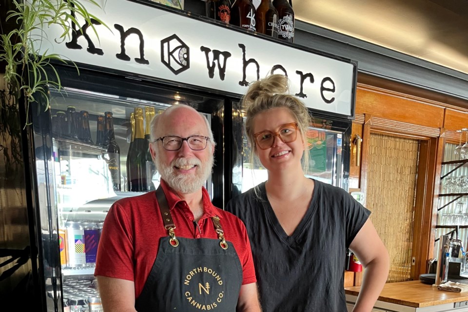 Owners Bill Crumplin and Kaitlin Lutyk stand near the bar inside the Knowhere Public House. The pub/cafe near the courthouse downtown is a space for all according to the pair.  From knitters, to bookworks, cyclists, authors and beyond, they offer a gathering space for all seven days per week.