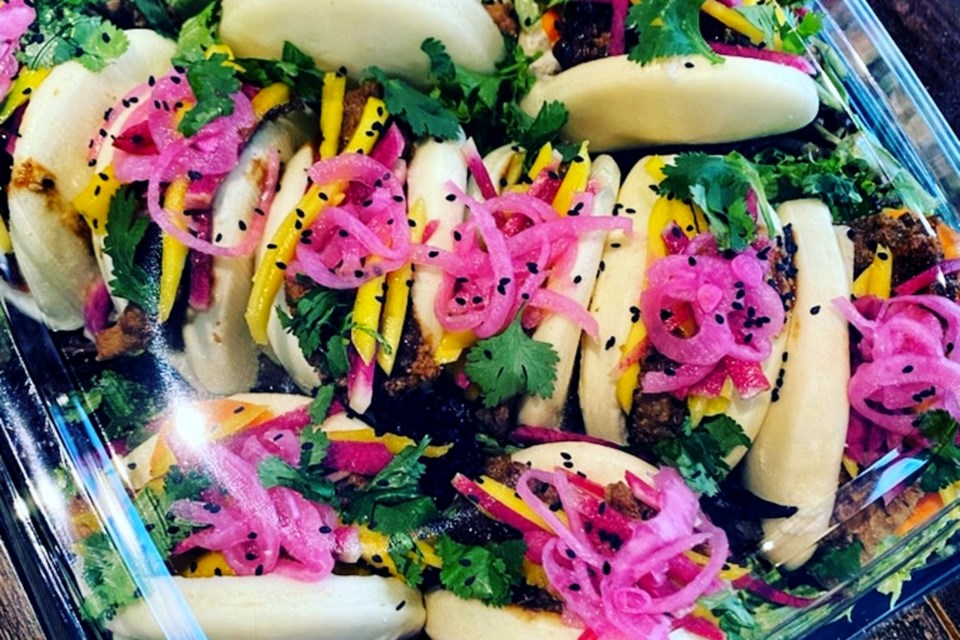 The food is often reviewed as flavourful and colourful. These steamed Chinese Bao Bun Platters are stuffed with various toppings and a homemade Beaucoup! sauce. 