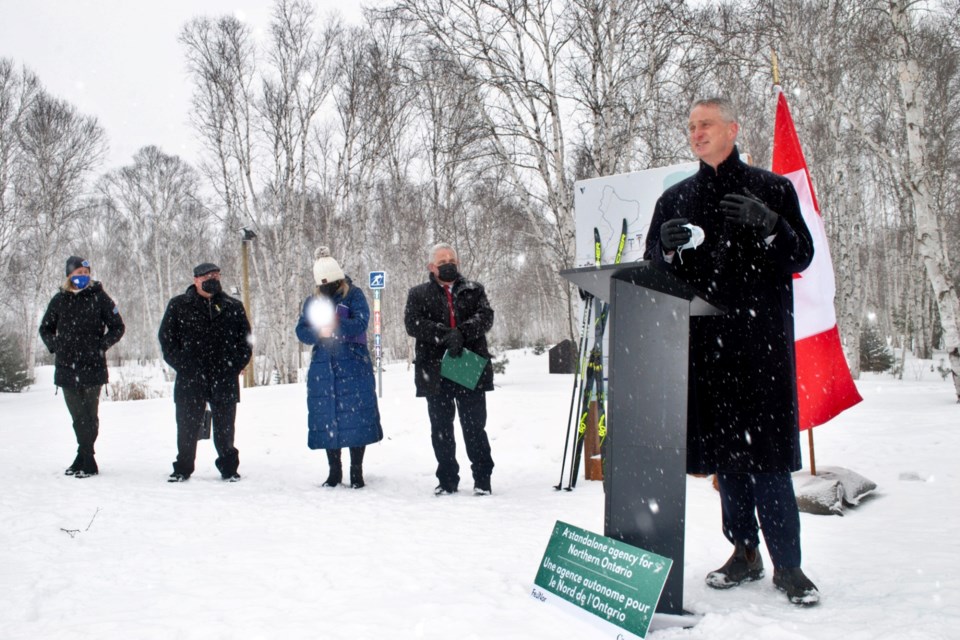 Kivi Park Community Foundation chair Bill Best speaks during an event at the park today, at which $444,891 in federal funding was announced for lighting along 3.5 kilometres of its four-season multi-use trails. In the background, from left, is Kivi Park executive director Kerry Lamarche, Mayor Brian Bigger, Sudbury Liberal MP Viviane Lapointe and Nickel Belt Liberal MP Marc Serré. 