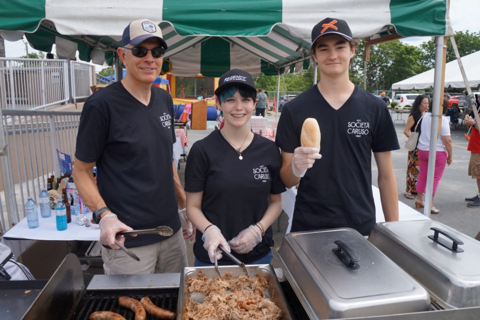 On the grill keeping the people fed is (from left) Luciano Valle, Shayla Pagnutti and Anthony Gutscher. 
