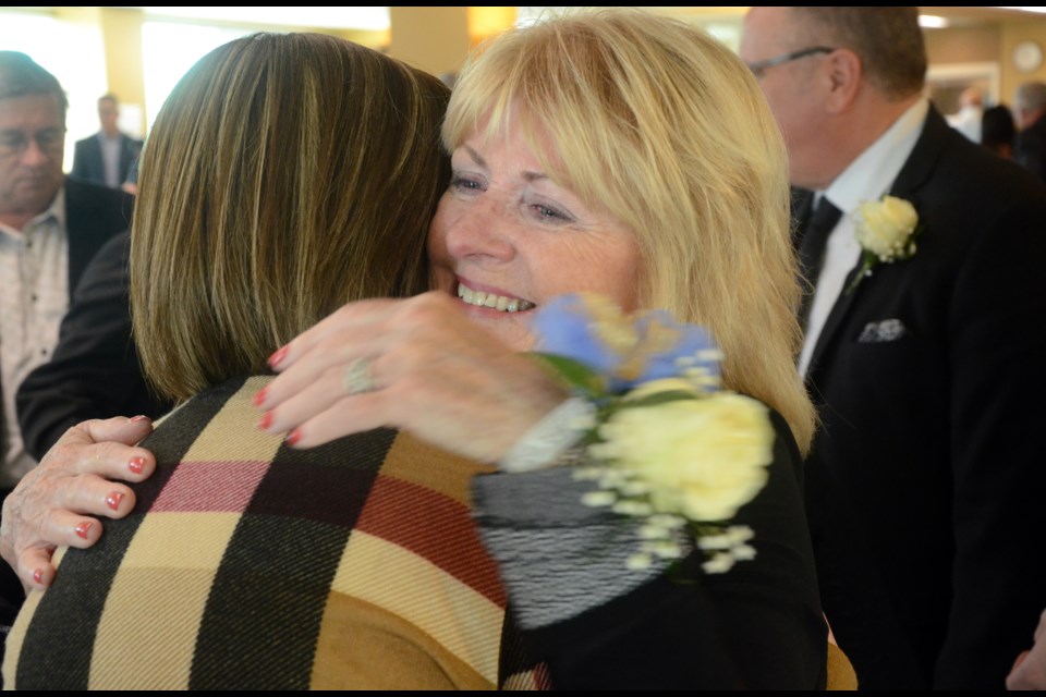 Cheryl Bruno gets a hug following the grand opening of the Sam Bruno PET Scanner on Oct. 9. (Arron Pickard/Sudbury.com)